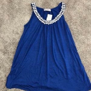 Royal blue top with bling. Flowy fit. NWT